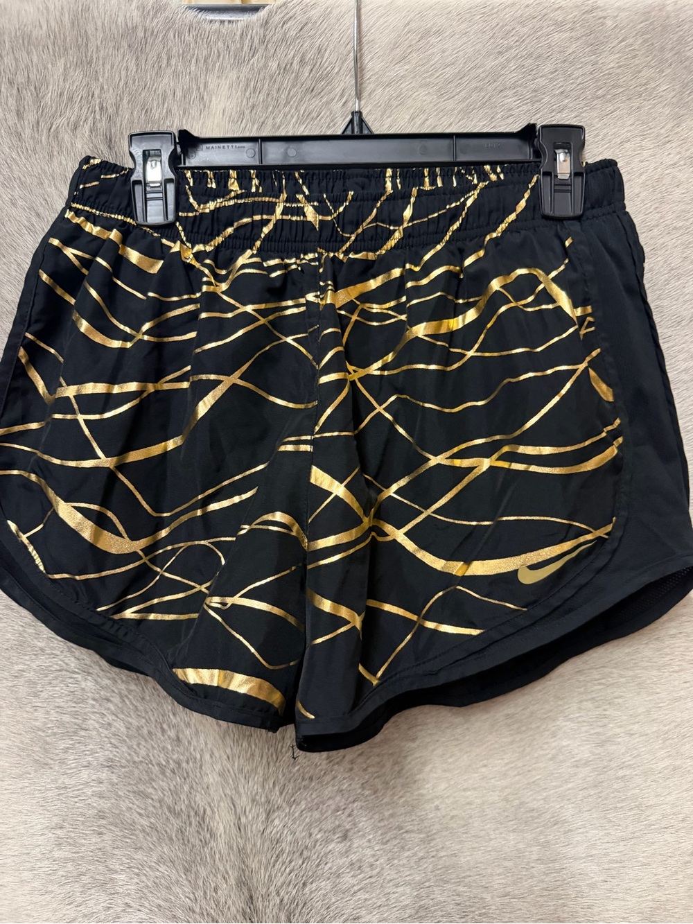 Nike Black Athletic Shorts ladies size large with Metallic Gold Wave Print